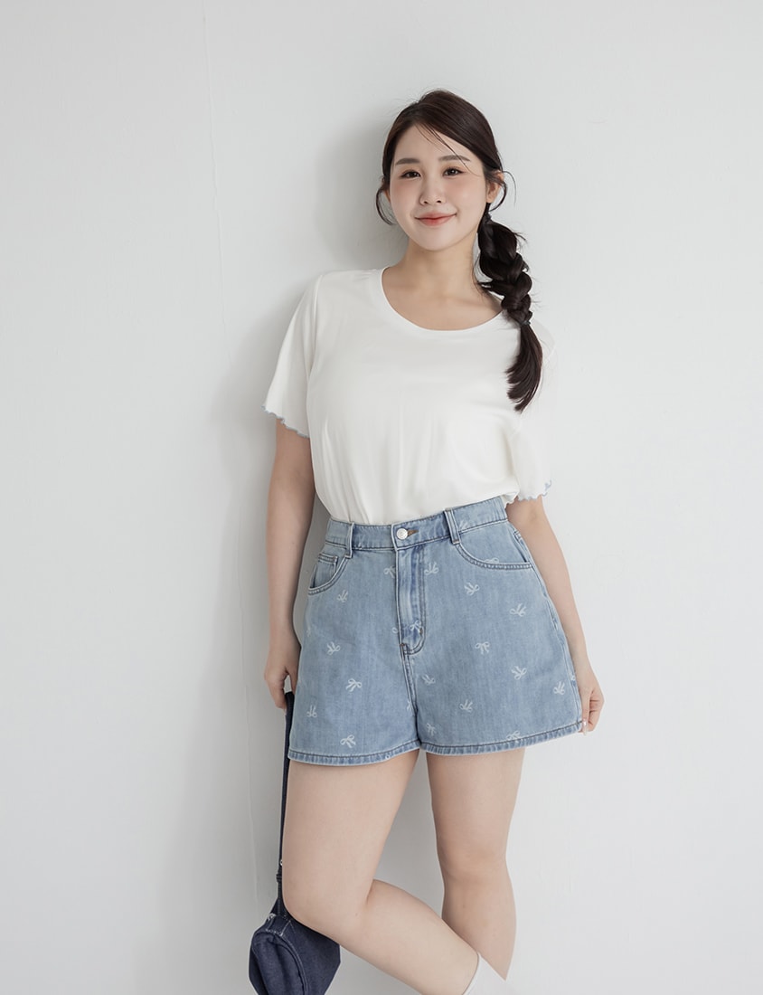 Playful All-Over Bow Plus Size Denim Shorts